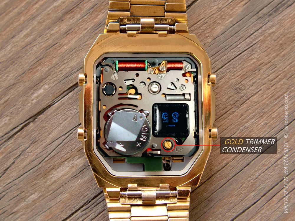 Click to enlarge... The watch after inserting the power cell and removing the green cover of the device with the Gold Trimmer capacitor exposed. Prepared for thermometer adjustment.
